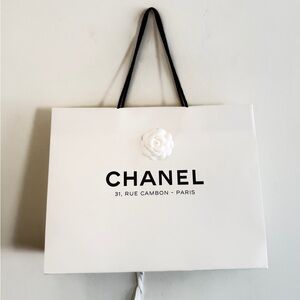 CHANEL White paper bag with Black Handles from the Parisian store rue cambon